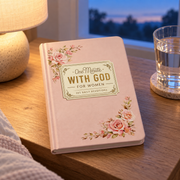 One Minute With God — For Women on a bedside table